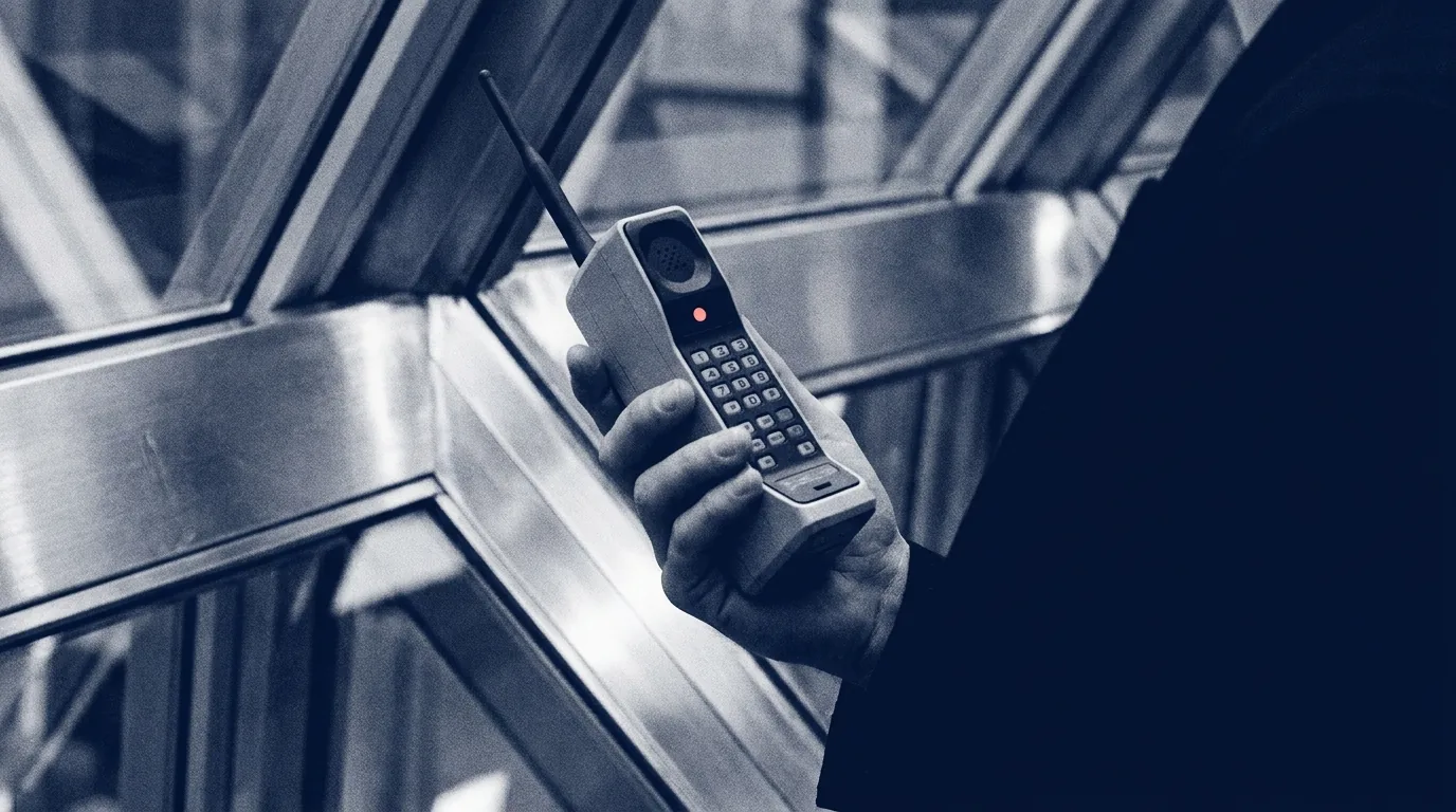 Retro phone with neon speech shapes